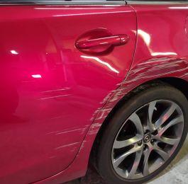 Passenger side rear wheel arch and door damage on this Mazda and with the Colour code being 41V representing the colour Soul red a three stage candy red pearl which are notoriously difficult to paint, but with the right application technique, materials and training you can produce a quality repair result restoring the vehicle to pre-accident condition.: Click Here To View Larger Image